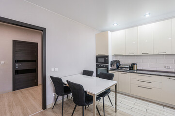 interior apartment kitchen and dining room, refectory area, cooking equipment, table furniture, stove