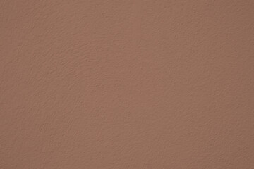 Fototapeta premium Mocha Mousse Colored Rough Wall Texture — 2025 Interior Color Trend, Background for Design with Neutral Painted Surface, Modern Warm-Toned Backdrop