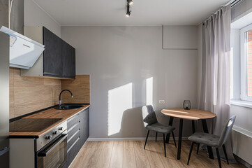interior apartment kitchen and dining room, refectory area, cooking equipment, table furniture, stove
