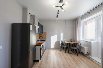 interior apartment kitchen and dining room, refectory area, cooking equipment, table furniture, stove