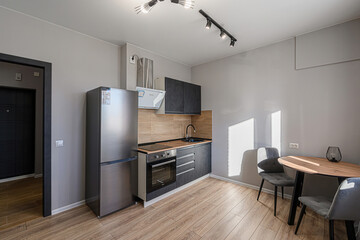interior apartment kitchen and dining room, refectory area, cooking equipment, table furniture, stove