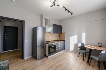 interior apartment kitchen and dining room, refectory area, cooking equipment, table furniture,...