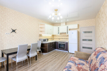 interior apartment kitchen and dining room, refectory area, cooking equipment, table furniture, stove
