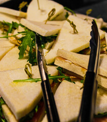 Close-up of Freshly Made Sandwiches with Greens