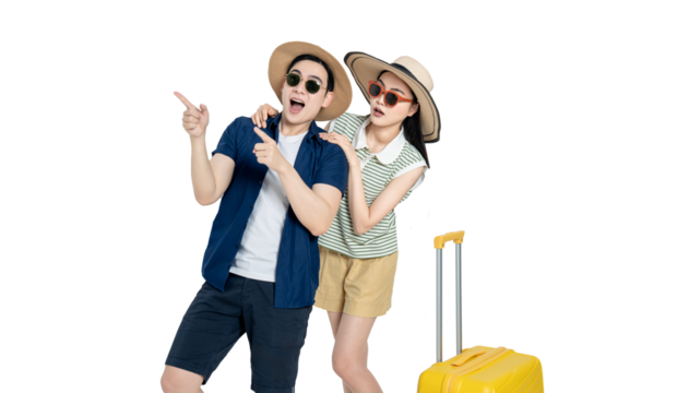 portrait of asian couple wearing travel clothes, suitcases and posing on white background