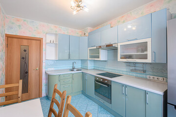 interior apartment kitchen and dining room, refectory area, cooking equipment, table furniture, stove