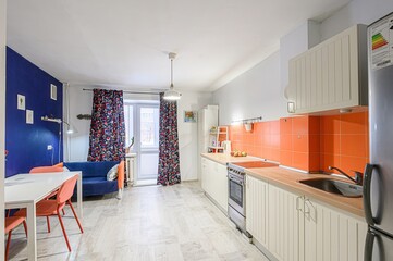 Obraz premium interior apartment kitchen and dining room, refectory area, cooking equipment, table furniture, stove