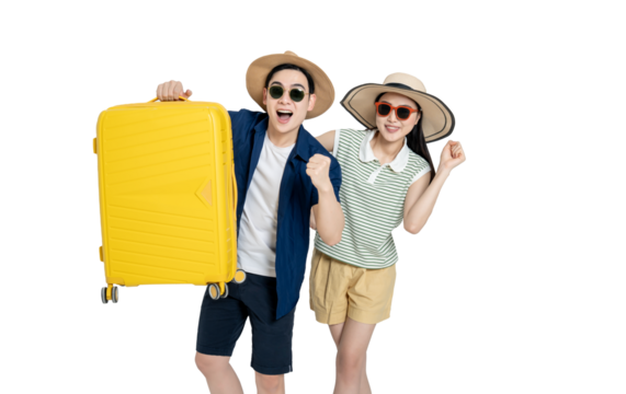 portrait of asian couple wearing travel clothes, carrying suitcases and posing on white background