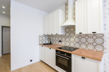 interior apartment kitchen and dining room, refectory area, cooking equipment, table furniture, stove