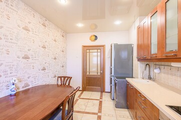 interior apartment kitchen and dining room, refectory area, cooking equipment, table furniture, stove