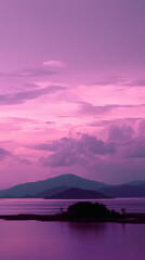 Fototapeta premium A serene landscape unveils a tranquil lake reflecting the majestic mountains beneath a vibrant pink and purple sky at dusk, showcasing nature's breathtaking beauty.