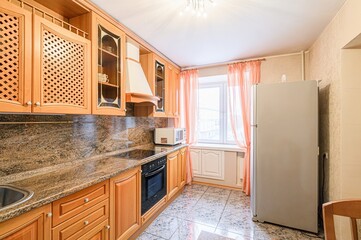 interior apartment kitchen and dining room, refectory area, cooking equipment, table furniture, stove