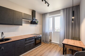 interior apartment kitchen and dining room, refectory area, cooking equipment, table furniture, stove