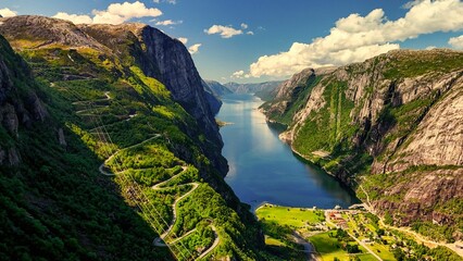 Explore the majestic Kjerag area in Lysebotn, Norway, where towering cliffs meet lush greenery and...