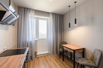 interior apartment kitchen and dining room, refectory area, cooking equipment, table furniture, stove