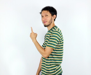 Man Pointing Upward Demonstrating a Point in Casual Studio Setting