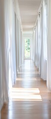Bright corridor with sunlight and flowing curtains.