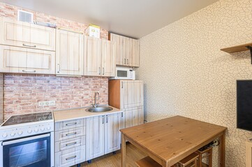 interior apartment kitchen and dining room, refectory area, cooking equipment, table furniture, stove