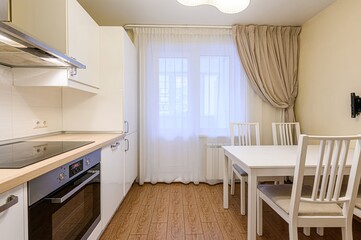 interior apartment kitchen and dining room, refectory area, cooking equipment, table furniture, stove