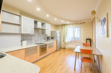 interior apartment kitchen and dining room, refectory area, cooking equipment, table furniture, stove