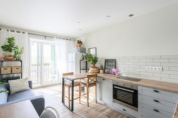 interior apartment kitchen and dining room, refectory area, cooking equipment, table furniture, stove