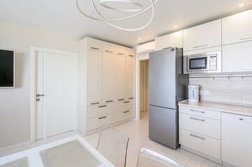 interior apartment kitchen and dining room, refectory area, cooking equipment, table furniture, stove