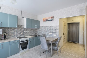 interior apartment kitchen and dining room, refectory area, cooking equipment, table furniture, stove