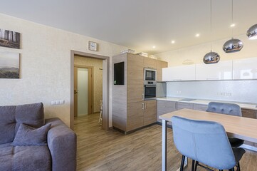 interior apartment kitchen and dining room, refectory area, cooking equipment, table furniture, stove