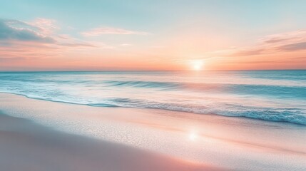 Fototapeta premium Sunset over calm ocean waves, with soft colors reflecting on sand