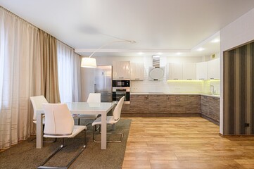 interior apartment kitchen and dining room, refectory area, cooking equipment, table furniture, stove