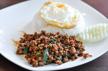 stir fried pork with holy basil , sunny side up egg and rice