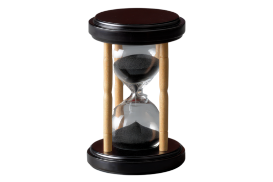 Elegant hourglass with black sand and wooden supports on a table