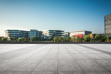 Modern Urban Architecture Against a Clear Sky with Expansive Pavement