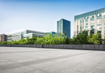 Modern Urban Cityscape with Greenery in Clear Blue Sky