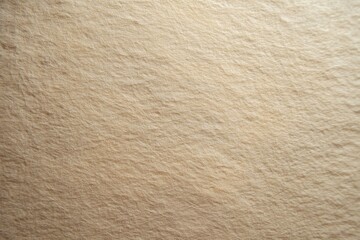 A soft, blurred beige cotton paper texture showcases delicate fibers against a neutral backdrop, evoking a calming and organic mood.