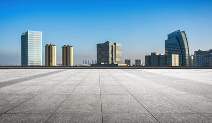 Panoramic Rooftop View of Modern Urban Skyline Under Clear Blue Sky