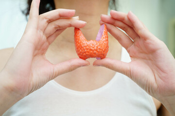 Hyperthyroidism, Overactive Thyroid, Thyroid Lymphoma, Asian woman with thyroid gland human anatomy...