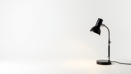 Black Desk Lamp Illuminating White Surface