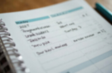 Obraz premium Blur background of Agenda Meeting Plan Schedule In Personal Organizer 