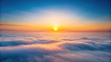 Fototapeta premium Serene Sunrise Above a Sea of Clouds A Breathtaking Celestial Panorama of Golden Hues and Soft, Rolling Mist