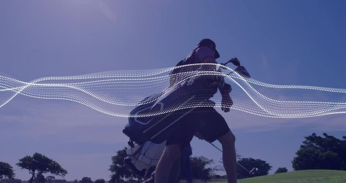 Golfer pulling golf trolley while caddy walking course, featuring dotted wave overlay for marketing