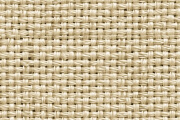 Obraz premium A tightly woven burlap texture displays a light tan tone, showcasing clean macro details and serving as a versatile, seamless background.