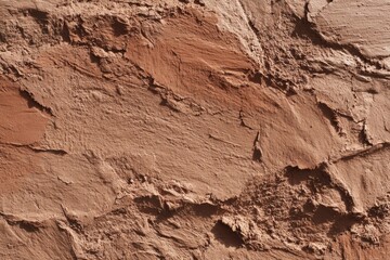 A seamless clay surface displays subtle imperfections, creating an earthy texture ideal for backgrounds or design elements.