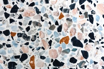 Pale terrazzo flooring displays fine chips and a matte finish, creating a subtly textured surface ideal for interior design or architectural detail.