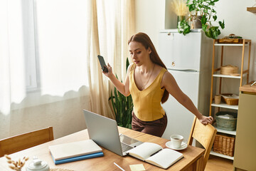 Young beautiful woman engages in a lively conversation while working in a cozy home office