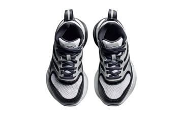 Above: Pair of monochrome athletic shoes on white, laces tied, modern design.