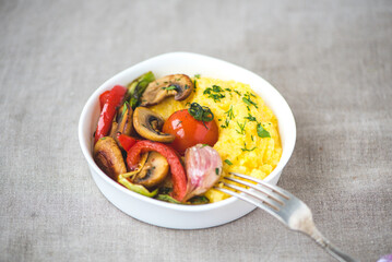 Healthy dishes with grilled vegetables and cereals. Italian polenta with vegetables.