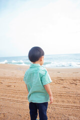 Kid playing in the beach. Connect with nature, sustainable development concept	
