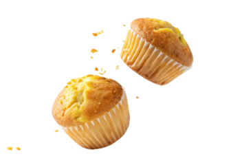 Delicious muffins are flying through air, showcasing their golden tops and fluffy texture, perfect for any sweet treat lover