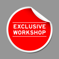 Red color peel sticker label with word exclusive workshop on gray background